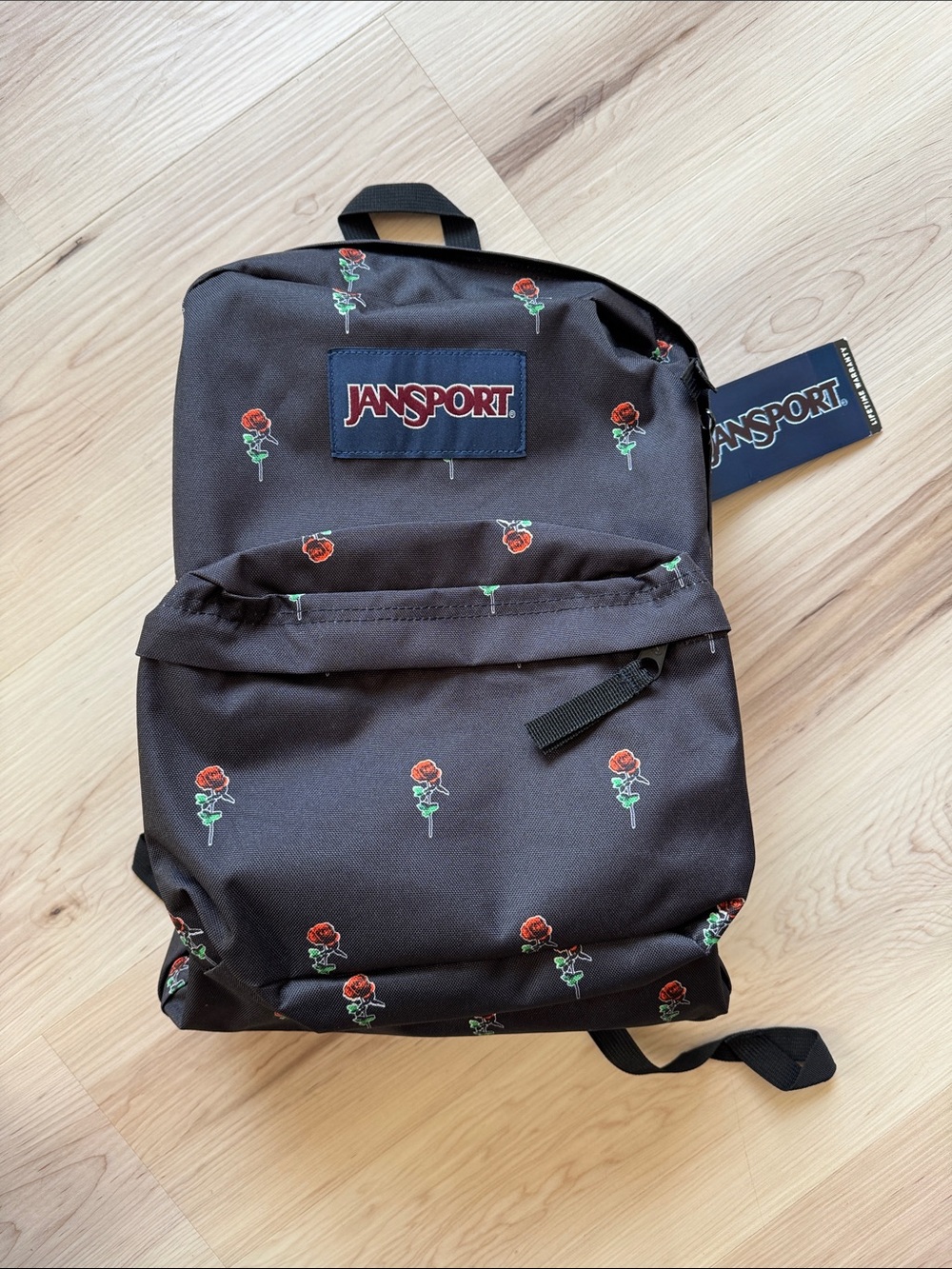 Jansport Black Backpack with Red Rose Print